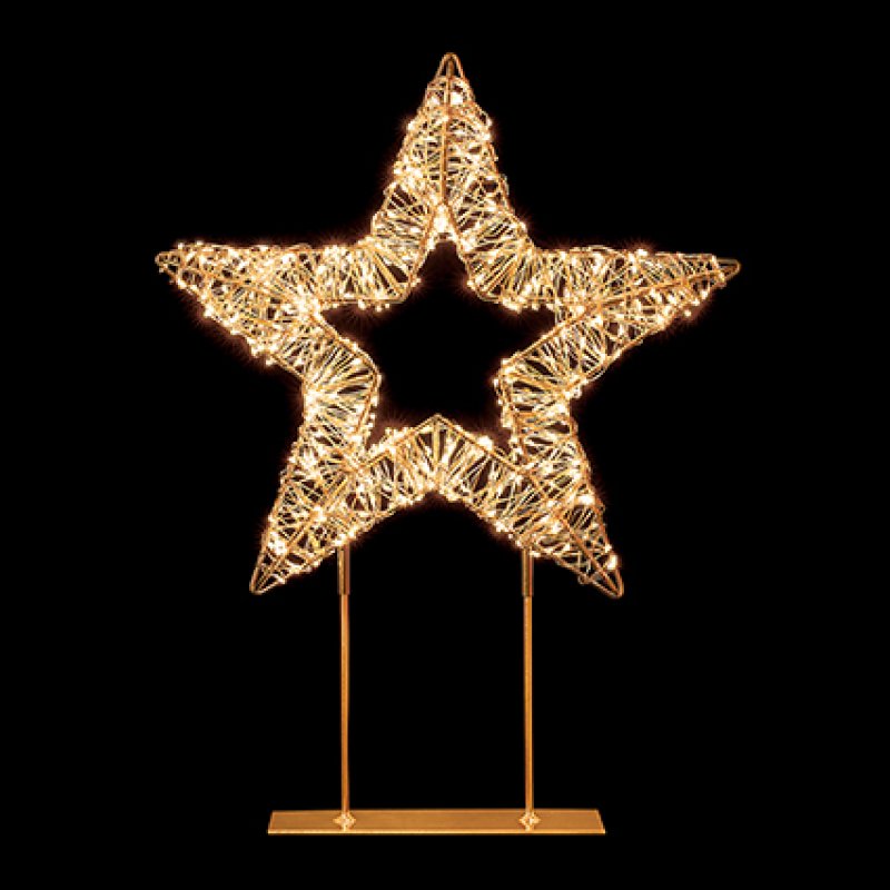 A glowing wire star decoration on a gold metal stand, set against a solid black background.