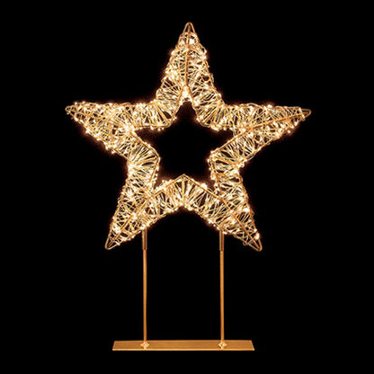 A glowing wire star decoration on a gold metal stand, set against a solid black background.
