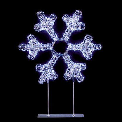 A snowflake-shaped decorative light fixture with six arms, glowing with cool white LED lights on a clear acrylic stand against a solid black background.