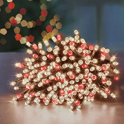 Close-up of Christmas lights with a blurred festive background