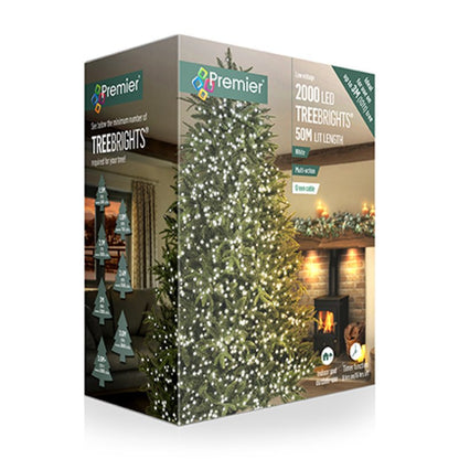 Premier 2000 LED TreeBrights 50m light-length Christmas tree lights in retail packaging, showing a decorated Christmas tree and warm holiday interior scenes on the box.