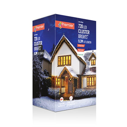 Premier 720 LED Cluster Brights Christmas string light box, featuring a snowy house illustration with vintage gold lights on the front packaging.