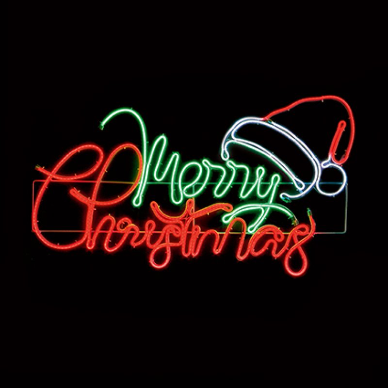 A glowing Christmas neon sign on a black background, featuring the words "Merry Christmas" in red and green script with a white and red Santa hat outline.