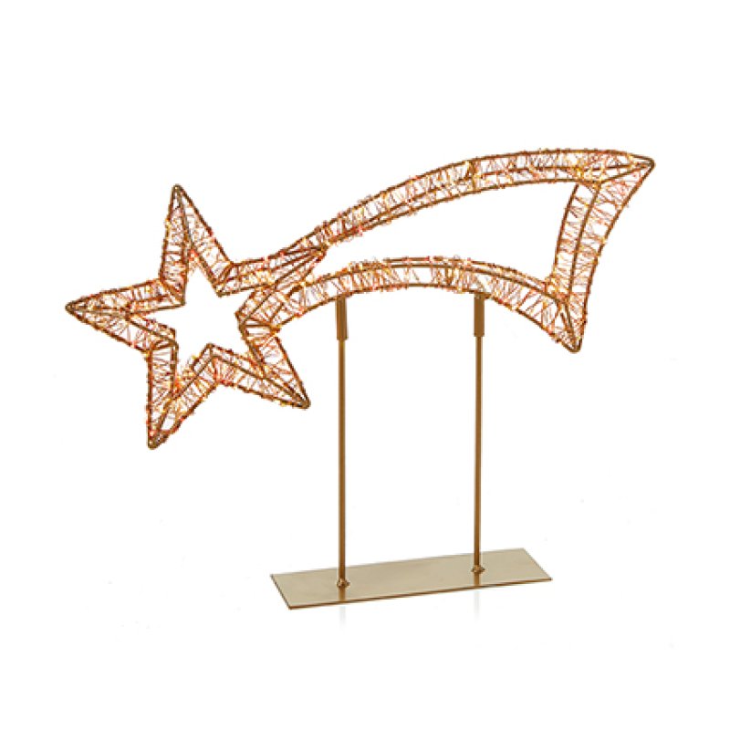 A wireframe decorative shooting star  sculpture with red and warm white LEDs in a gold tone, mounted on a slim gold-coloured metal stand with a rectangular base, set against a plain white background.