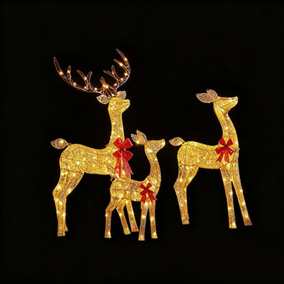Three illuminated deer holiday light decorations in gold with red bow accents, set against a solid black background.