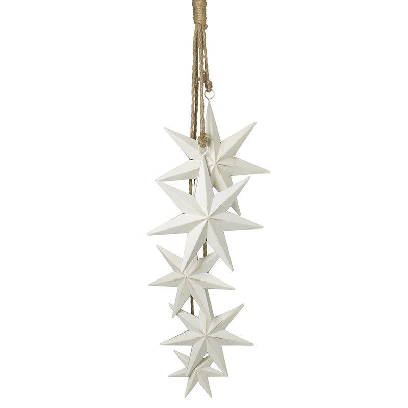 A hanging decoration featuring five white metal stars of different sizes, attached to a jute rope.