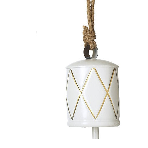 Decorative bell in white with gold geometric patterns on a white background.