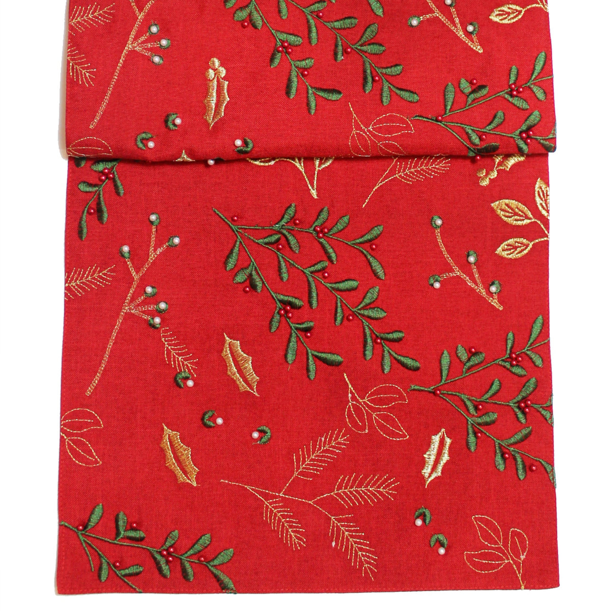 Red fabric with green leaf pattern on a white background