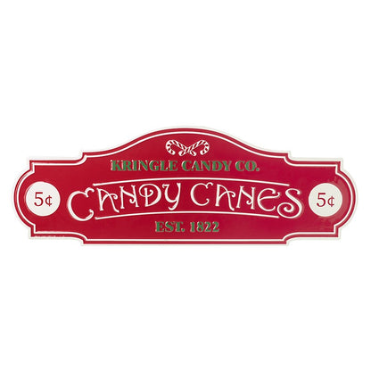 A vintage style Christmas sign with 'Kringle Candy Co. Candy Canes' text in red, white, and green colors.