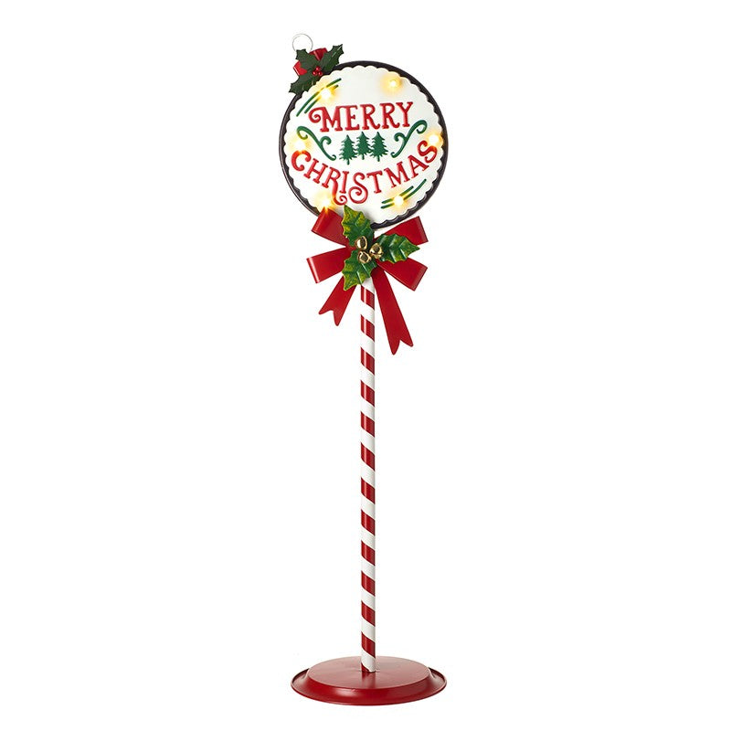 A vintage style light up Christmas sign with a red bow and holly, the sign reads 'Merry Christmas' and is placed on a candy cane pole.