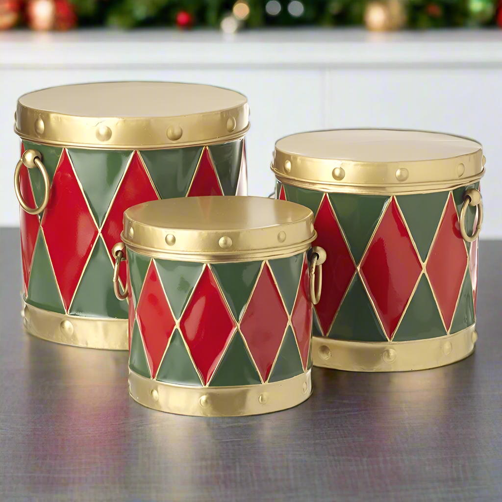 Set of 3 traditional drum-shaped Christmas storage tins in red, green, and gold colors with a geometric pattern and metal handles.