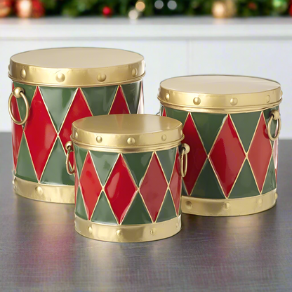 Set of 3 traditional drum-shaped Christmas storage tins in red, green, and gold colors with a geometric pattern and metal handles.