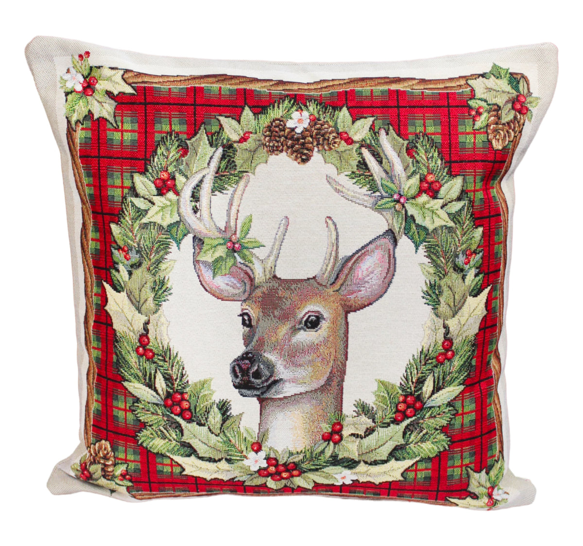 A square decorative throw pillow featuring a woven design of a deer head surrounded by a green wreath with red berries and pinecones, set against a red plaid background.