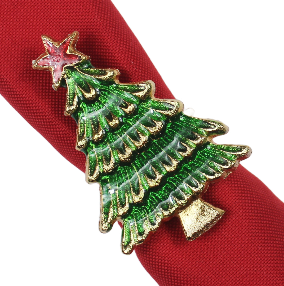 A Christmas tree shaped napkin ring with a gold-tone metal outline, green enamel layers, a red star topper, and a small gold   base, shown wrapped around a red fabric napkin on a white background.