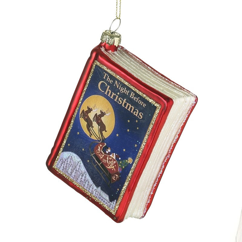 Decorative ornament shaped like a book titled 'The Night Before Christmas' on a white background