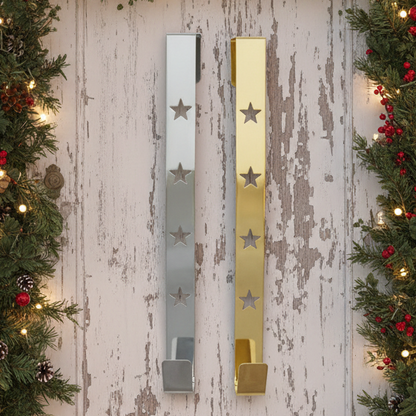 Two star design wreath hangers, one with a silver star cut out on a gold background and the other with a gold star cut out on a silver background.