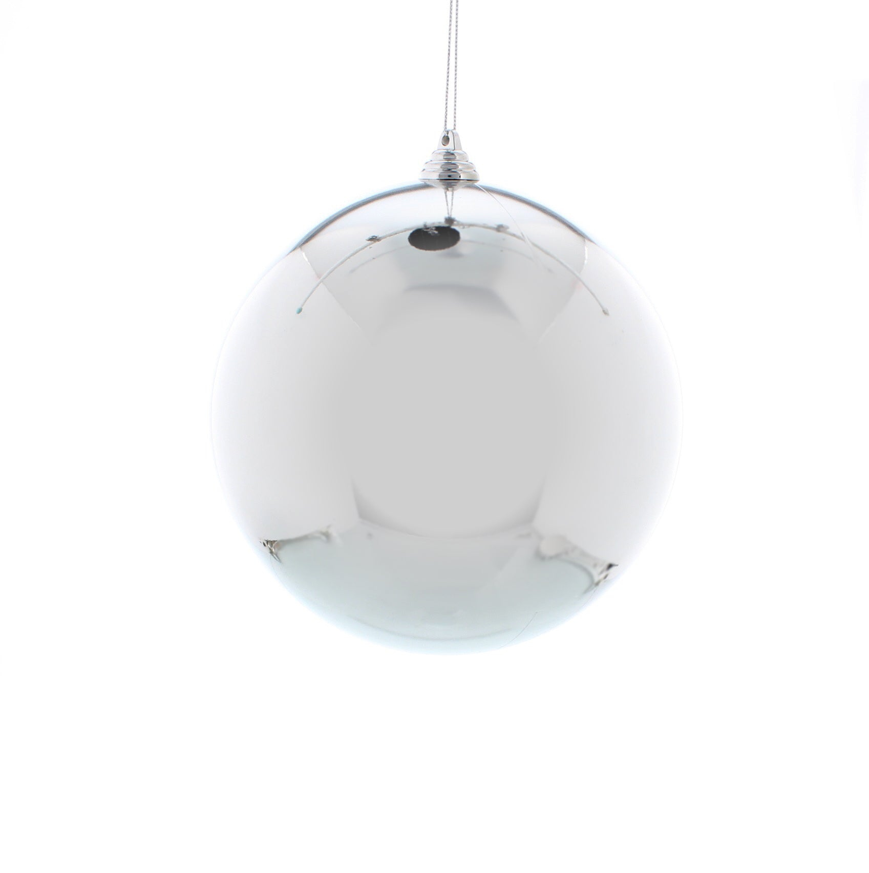 A single shiny silver shatterproof bauble hanging against a white background.