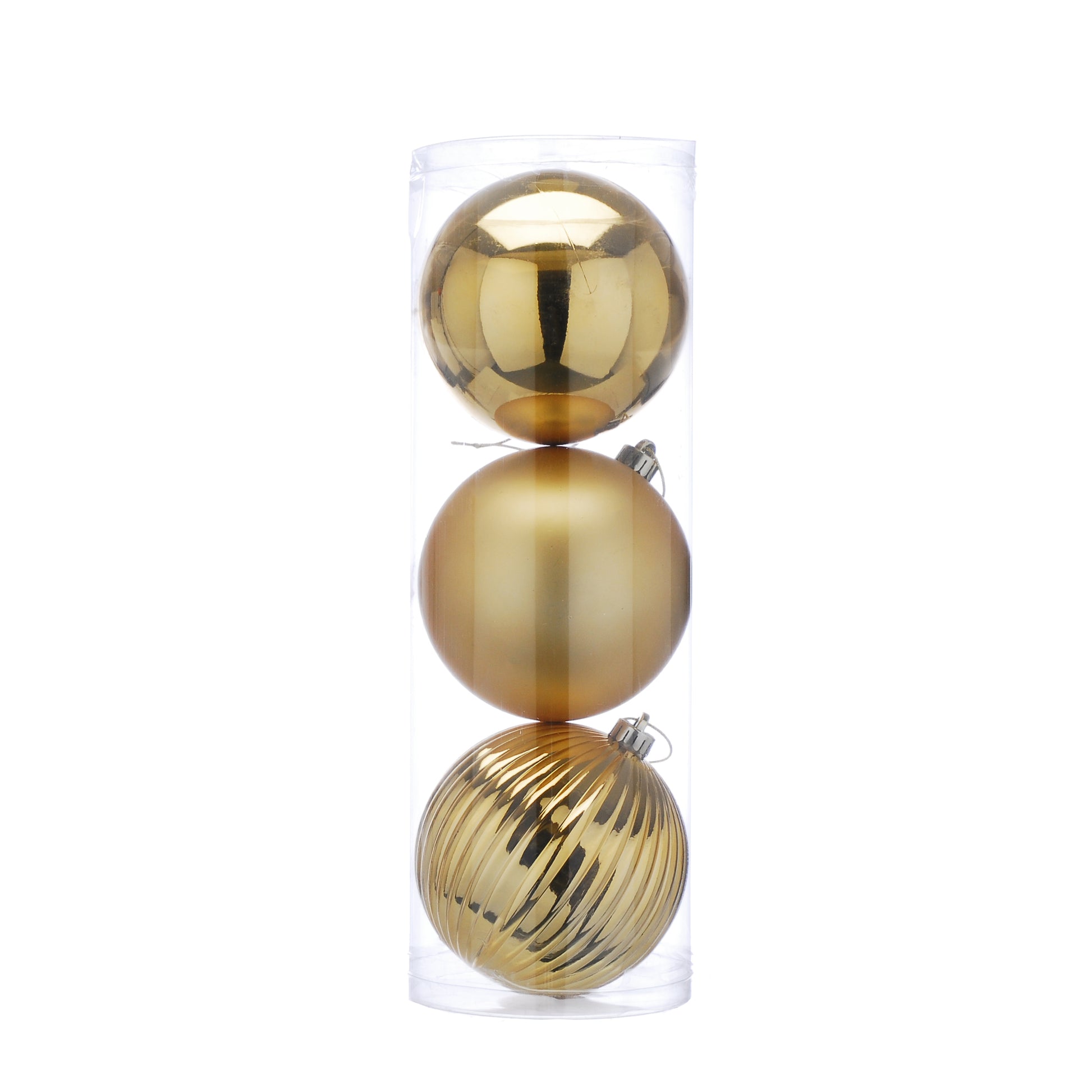 Three gold Christmas ornaments stacked inside a clear plastic box on a white background