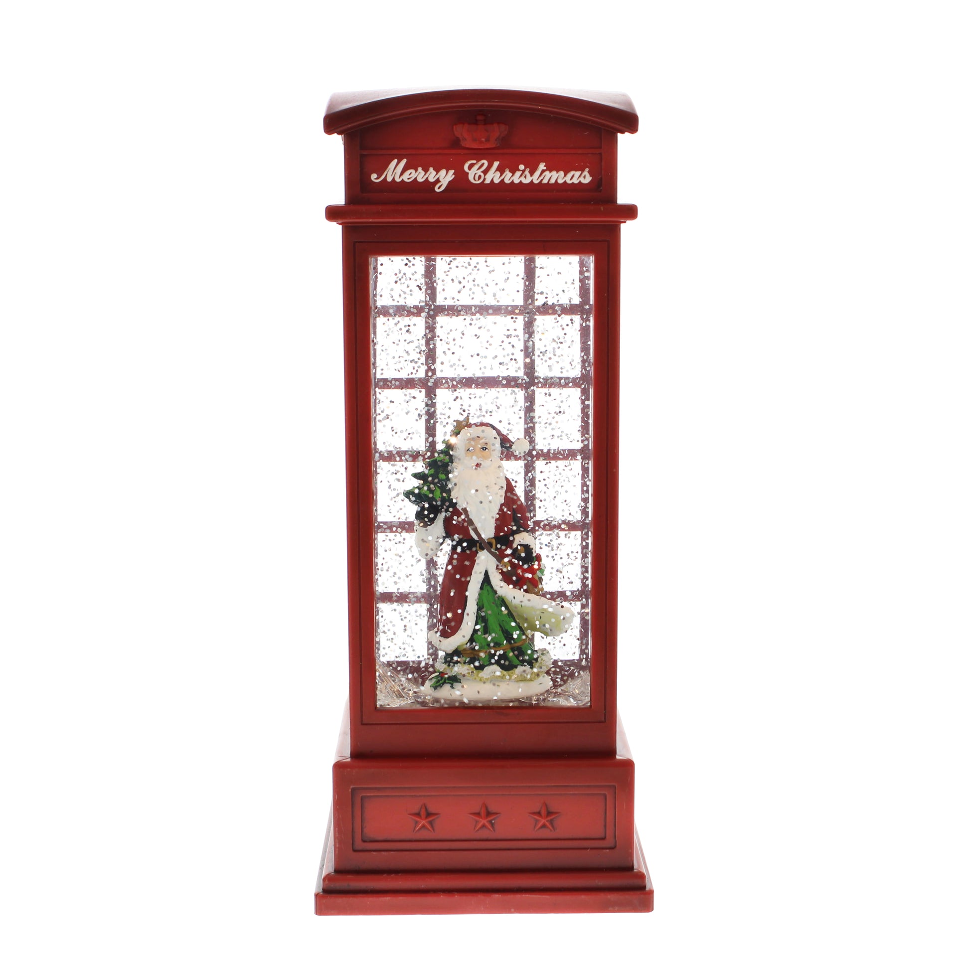 A Christmas-themed red telephone booth decoration with a glittery window, featuring a Santa Claus figurine holding a small tree inside. The top of the booth has 'Merry Christmas' written in white script.