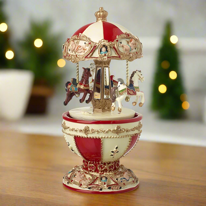 A decorative Egg Shape Christmas Merry Go Round music box with traditional carnival horses rotating inside, displayed on a table with festive decorations in the background.