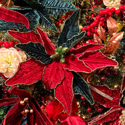 A close-up of a red and green poinsettia stem with artificial leaves, designed for use in holiday decorations.