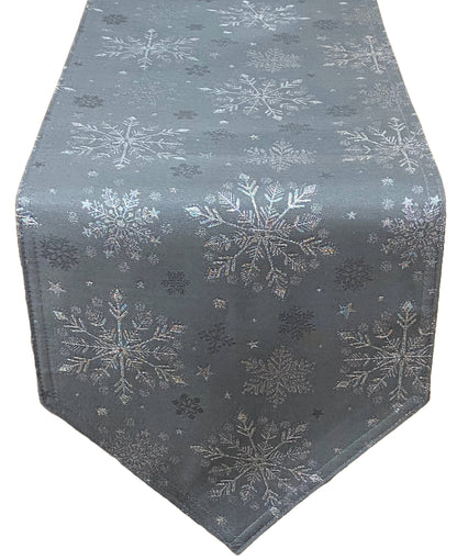 A pewter table runner with a repeating pattern of silver snowflakes, shown against a plain white background.