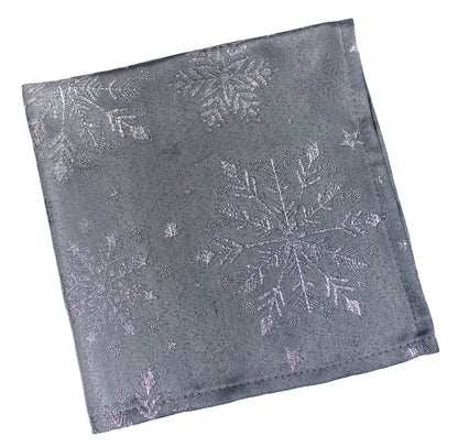 A square pewter napkin  square featuring a silver glitter snowflake pattern, shown on a plain white background.