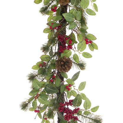 Decorative garland with green leaves, red berries, and pinecones on a white background