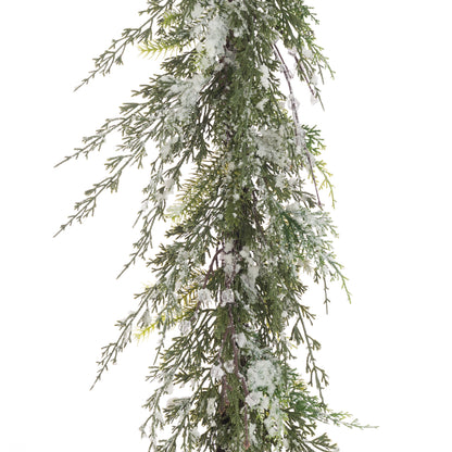 Faux Christmas garland with snow effects on a white background