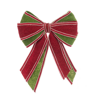 A festive Christmas bow made of glittery red and green ribbon with white stitched edges, isolated on a white background.