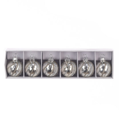 Set of six silver glass ornaments in a white box on a white background