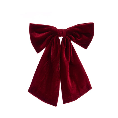 Red velvet bow on a white background