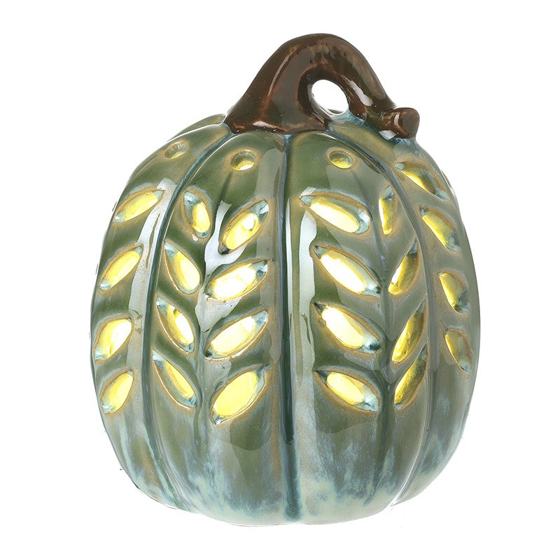 Decorative ceramic pumpkin with a textured surface on a white background