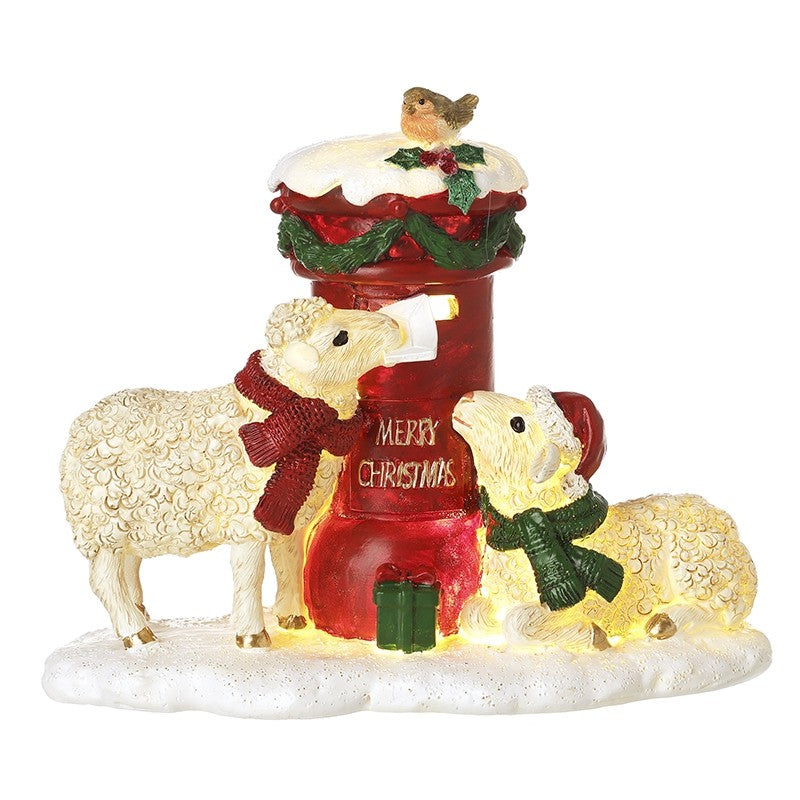 Decorative Christmas scene with sheep, a red postbox, and a bird on a white background