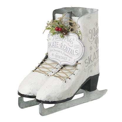 Decorative ice skates with a sign reading 'North Pole Skate Rentals' on a white background.