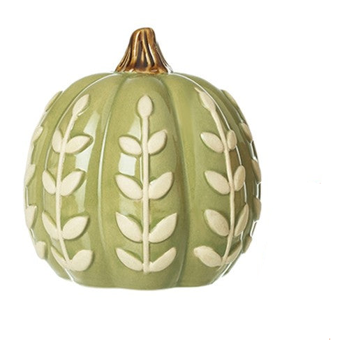 A decorative ceramic pumpkin in sage green with raised cream leaf patterns and a small gold-toned stem, shown on a plain white background.
