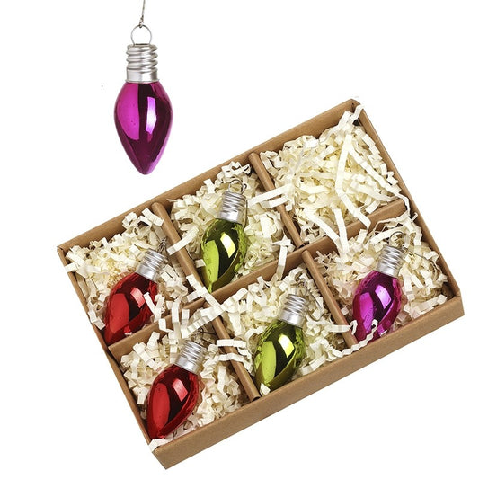 Box of Christmas light bulb ornaments with a purple ornament hanging above.