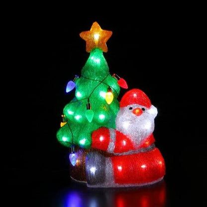 An acrylic Santa Claus figure with a Christmas tree adorned with multicolored lights.